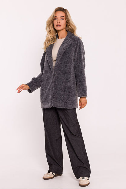 Luxurious oversized teddy bear coat for women by Moe, featuring decorative snap closure and elegantly sewn pockets in a warm, stylish design.