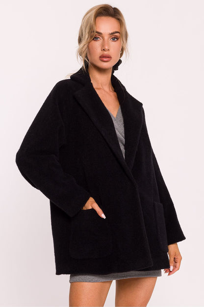 Showcasing the fully lined interior of Moe's women's oversized teddy bear coat, perfect for comfort on cooler days.