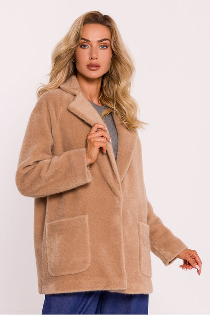 Luxury oversized teddy bear coat for women by Moe, featuring decorative snap closure and elegant sewn pockets, perfect for cooler days.