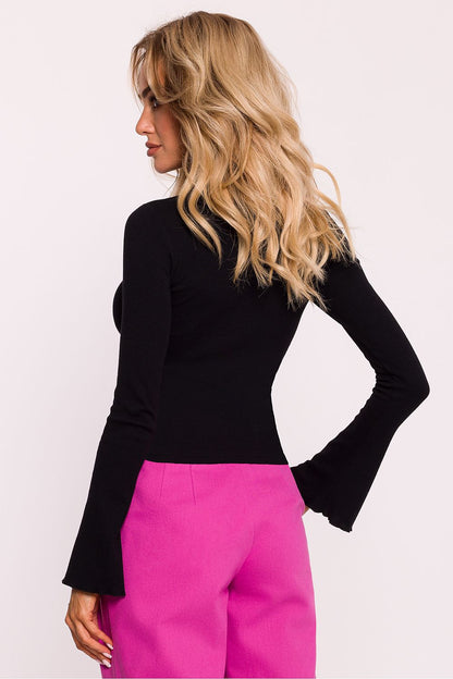 A stylish close-up of the decorative stitching on the elegant ribbed cotton knit blouse by Moe, perfect for the discerning fashionista.