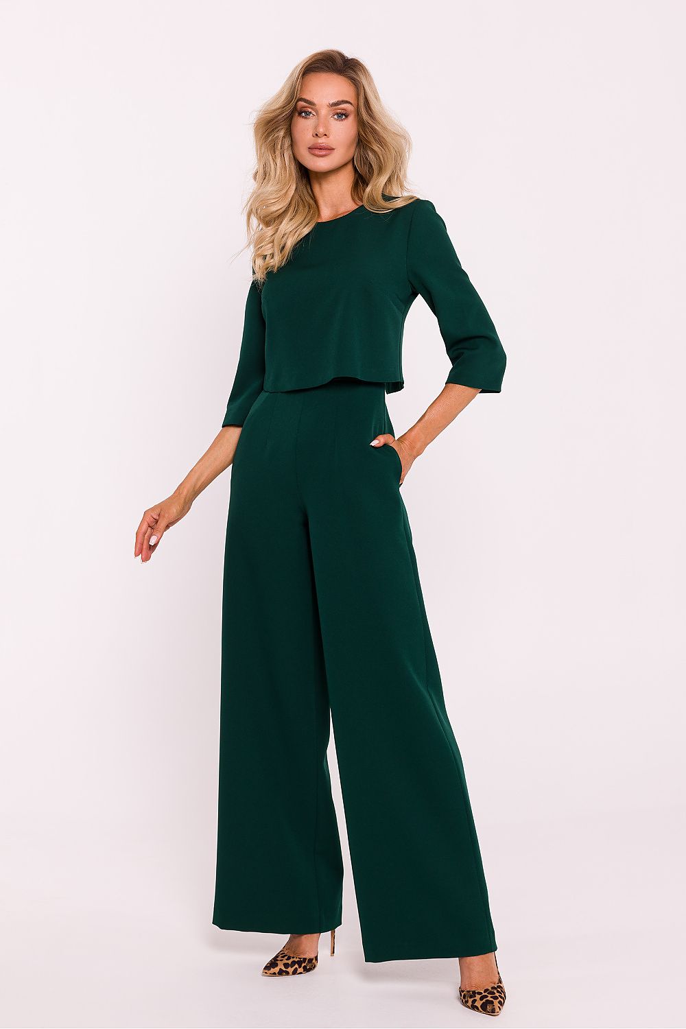 Elegant women's jumpsuit by Moe featuring wide legs and a double-layered top, showcasing luxury fashion designed for comfort with practical side pockets.
