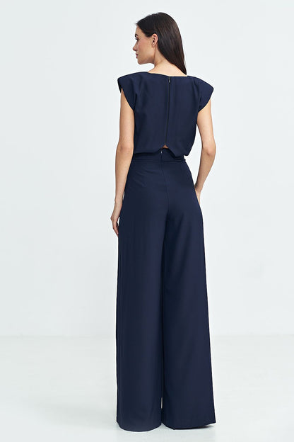 Back view of the Nife Boat Neck Jumpsuit with a sleek zipper fastening, demonstrating elegance and ease for stylish wear at special occasions.