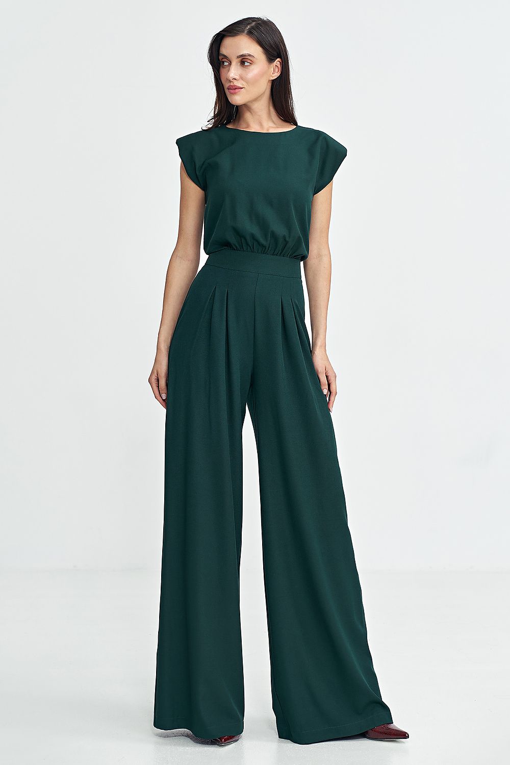 Full length image of the Nife Elegant Boat Neck Jumpsuit in a flowing Palazzo style, ideal choice reflecting luxury and comfort for upscale gatherings.