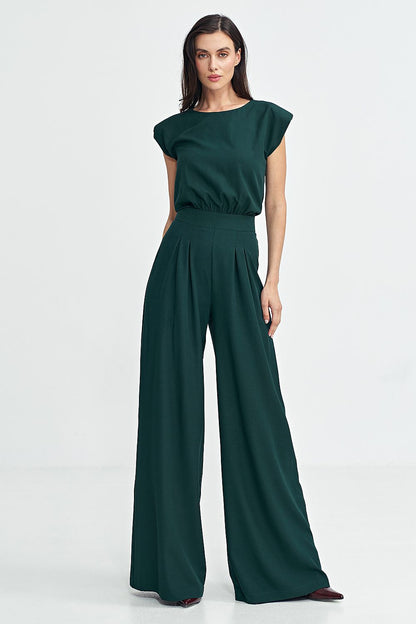 Elegant Nife boat neck jumpsuit featuring shoulder pads and palazzo pants, perfect for special occasions.