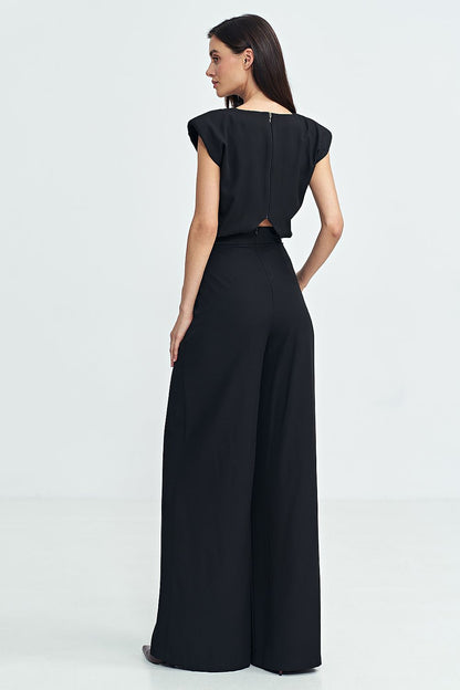 Back zipper detail of Nife's elegant jumpsuit, combining style and ease for special occasions.