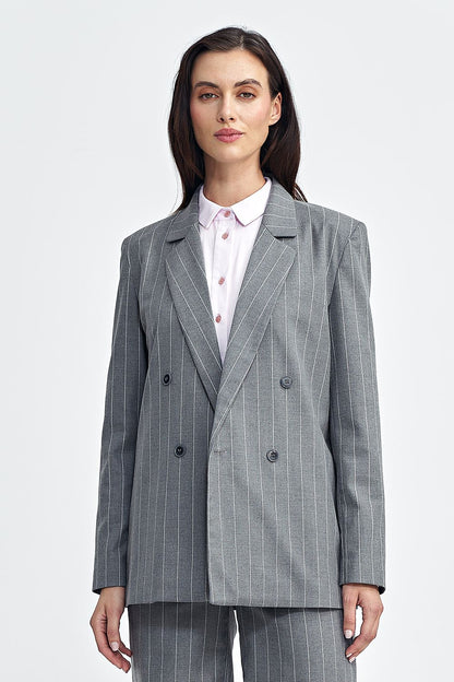 Elegant oversized blazer by Nife featuring tennis-style stripes and a double-breasted closure, perfect for a sophisticated look.