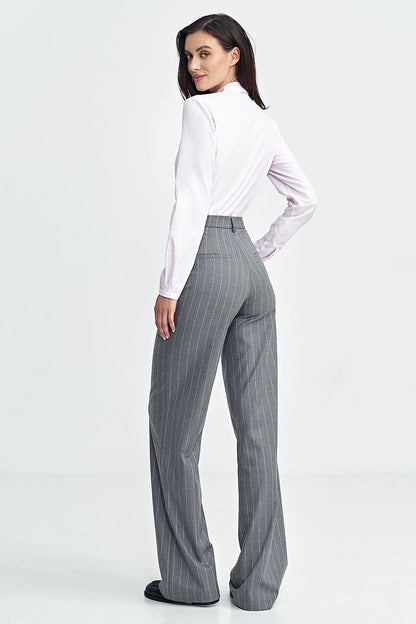 Elegant women's bootcut trousers by Nife, featuring a high waist and subtle tennis-style stripes, designed for a luxurious silhouette.