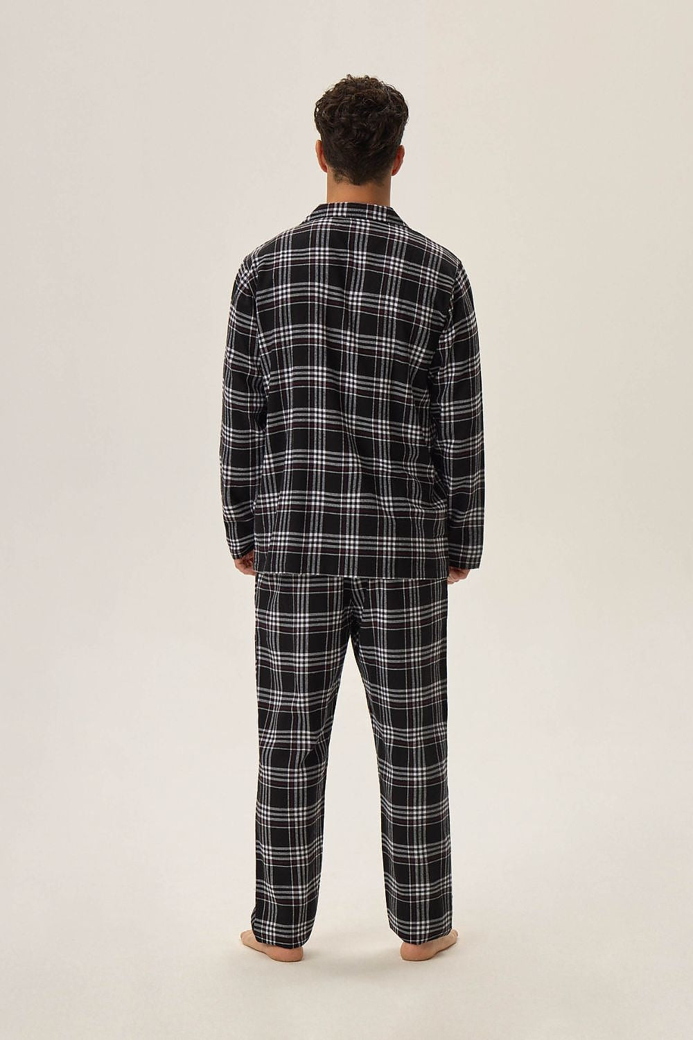 Stylish close-up of Henderson Men's HONOR 2 Cotton Pyjamas, highlighting the elegant black checkered pattern and soft 100% cotton fabric for a premium sleep experience.