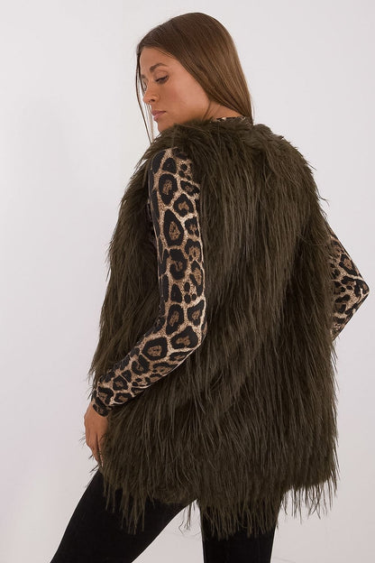 Stylish layering with AT's women's fur vest, made from premium polyester for ultimate comfort and sophistication.