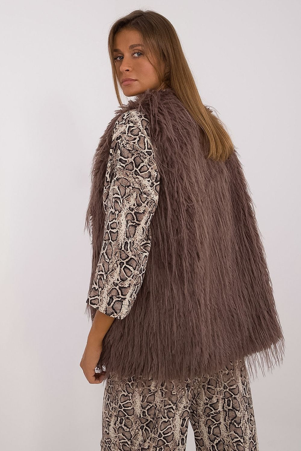 Chic and stylish polyester fur vest for women by AT, designed for layering on cooler days, showcasing a sophisticated look.