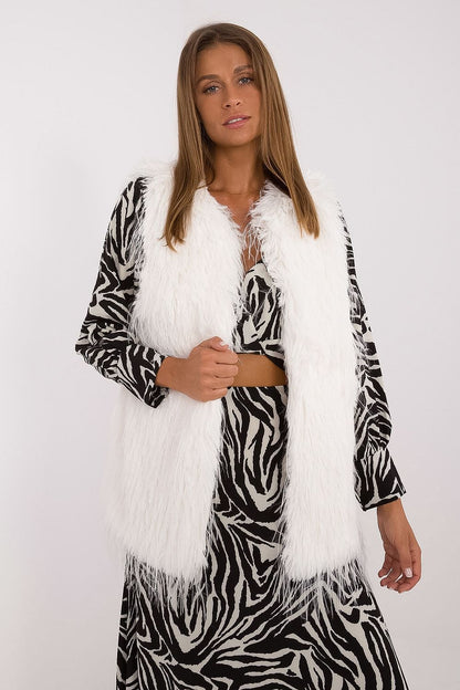 Chic ensemble featuring the AT women's fur vest, illustrating its versatility and luxurious appeal in everyday fashion.
