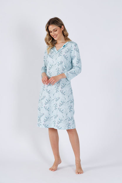 Elegant M-Max nightshirt in 100% cotton featuring V-neck and decorative bow, perfect for stylish and comfortable sleep.