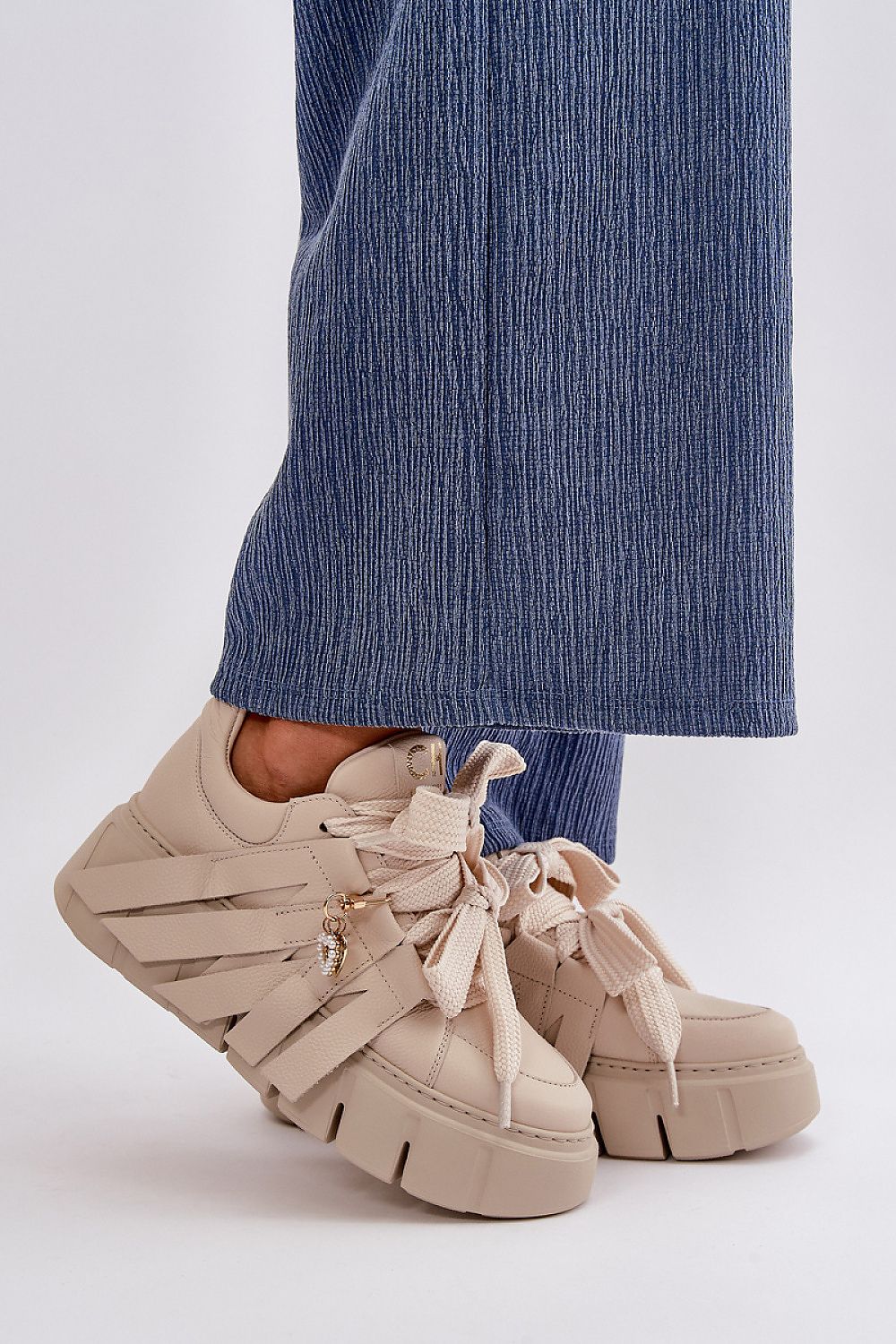 Elegant women's natural leather sneakers by Step in Style, featuring thick lacing and romantic heart details, designed with a 5cm platform for a stylish and modern look.