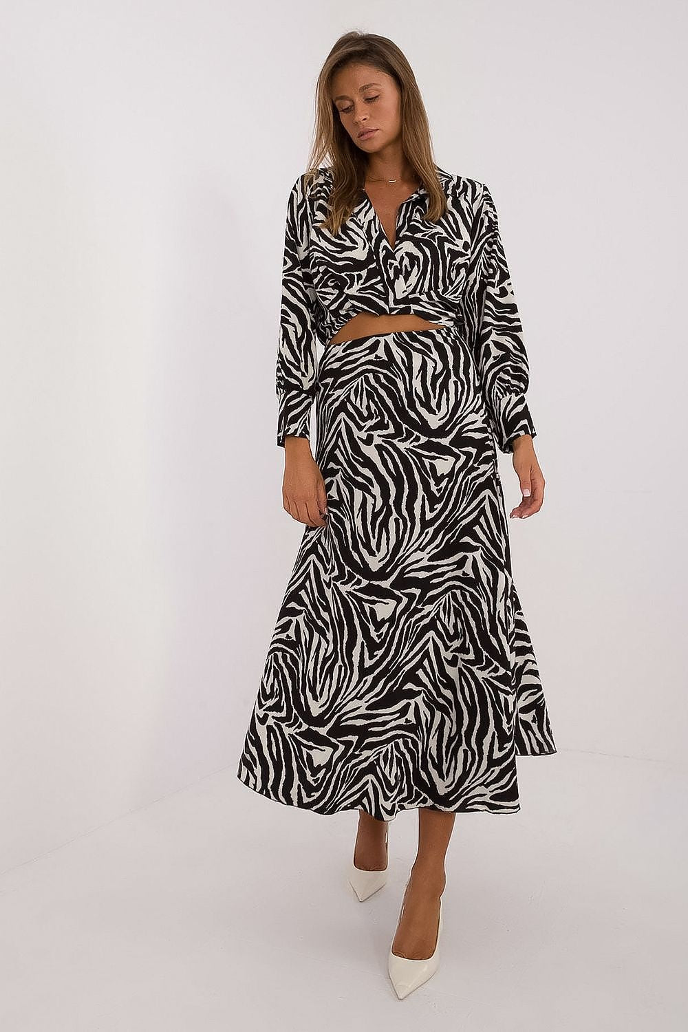 Elegant women's animal motif set featuring a stylish long sleeve blouse and skirt made by Italy Moda, showcasing a luxurious polyester blend for ultimate comfort.