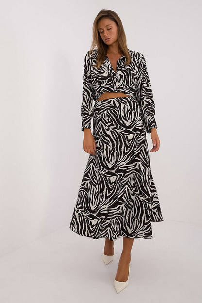 Elegant women's animal motif set featuring a stylish long sleeve blouse and skirt made by Italy Moda, showcasing a luxurious polyester blend for ultimate comfort.