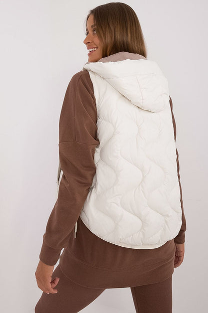 Elegant view of MBM women's lightweight polyester down vest, designed for superior insulation and warmth, ideal for layering in chic winter outfits.