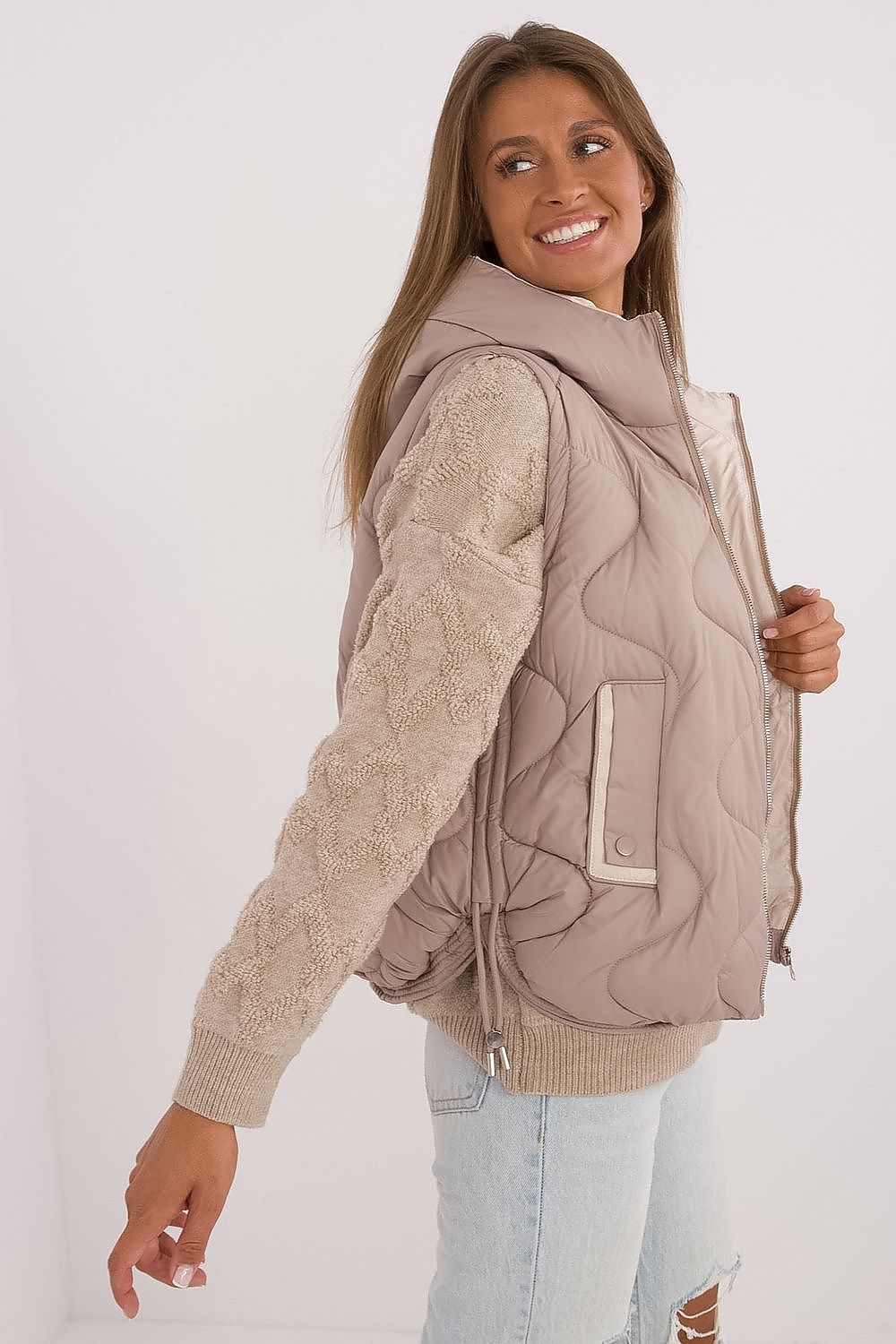 Close-up view of MBM Women's Quilted Down Vest with Hood, highlighting fine polyester material and premium synthetic insulation for exceptional comfort and heat retention.