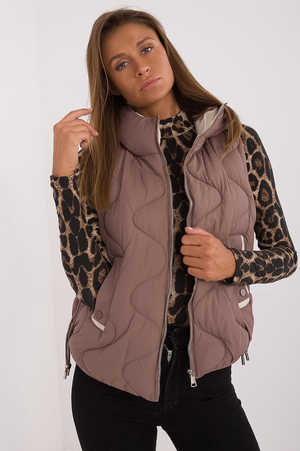 Luxury women's quilted down vest with hood by MBM, showcasing its lightweight synthetic insulation and elegant design, perfect for casual styling on cooler days.