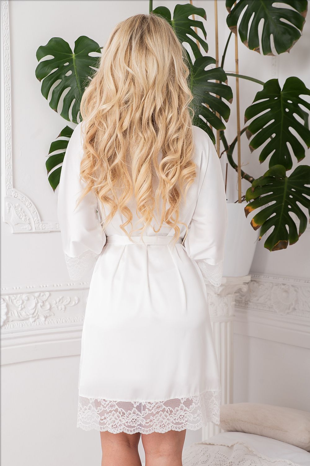 Satin bathrobe by Kalimo displayed elegantly, showcasing exquisite lace detailing and a chic satin belt, perfect for indulgent mornings.