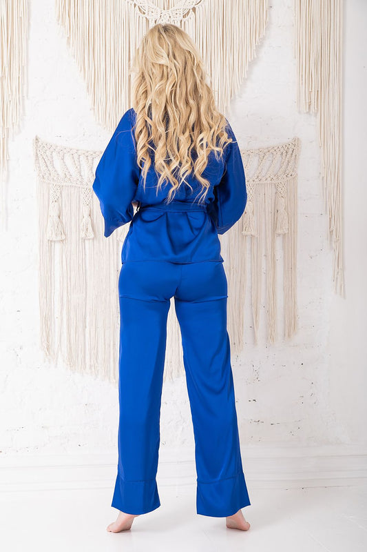 Close-up of the Kalimo satin pajama set showcasing the delicate fabric and stylish design of the kimono blouse and tailored straight pants.