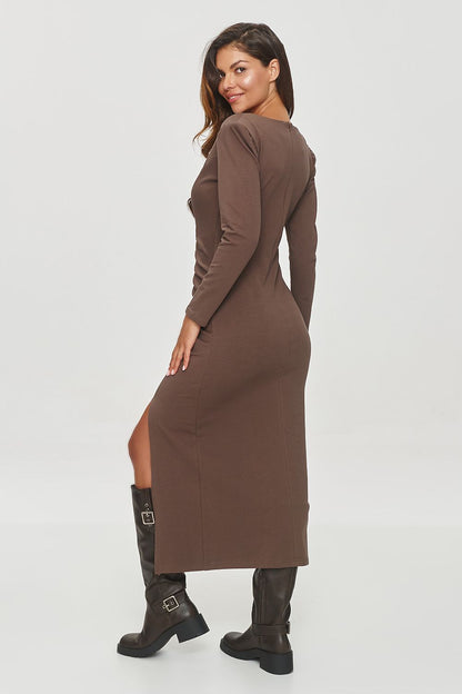 Front view of the Makadamia Mid-Calf Day Dress with a subtle slit, perfect for pairing with boots for a chic evening look.
