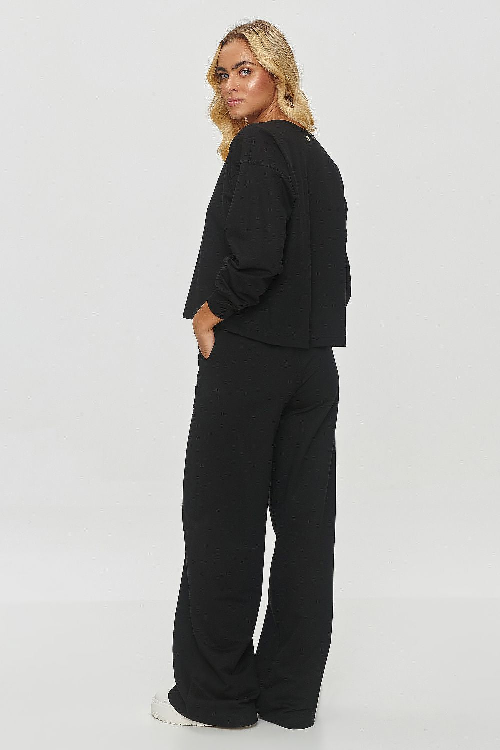 Luxury Makadamia tracksuit set featuring a comfortable oversized sweatshirt and wide leg trousers, perfect for stylish casual wear.