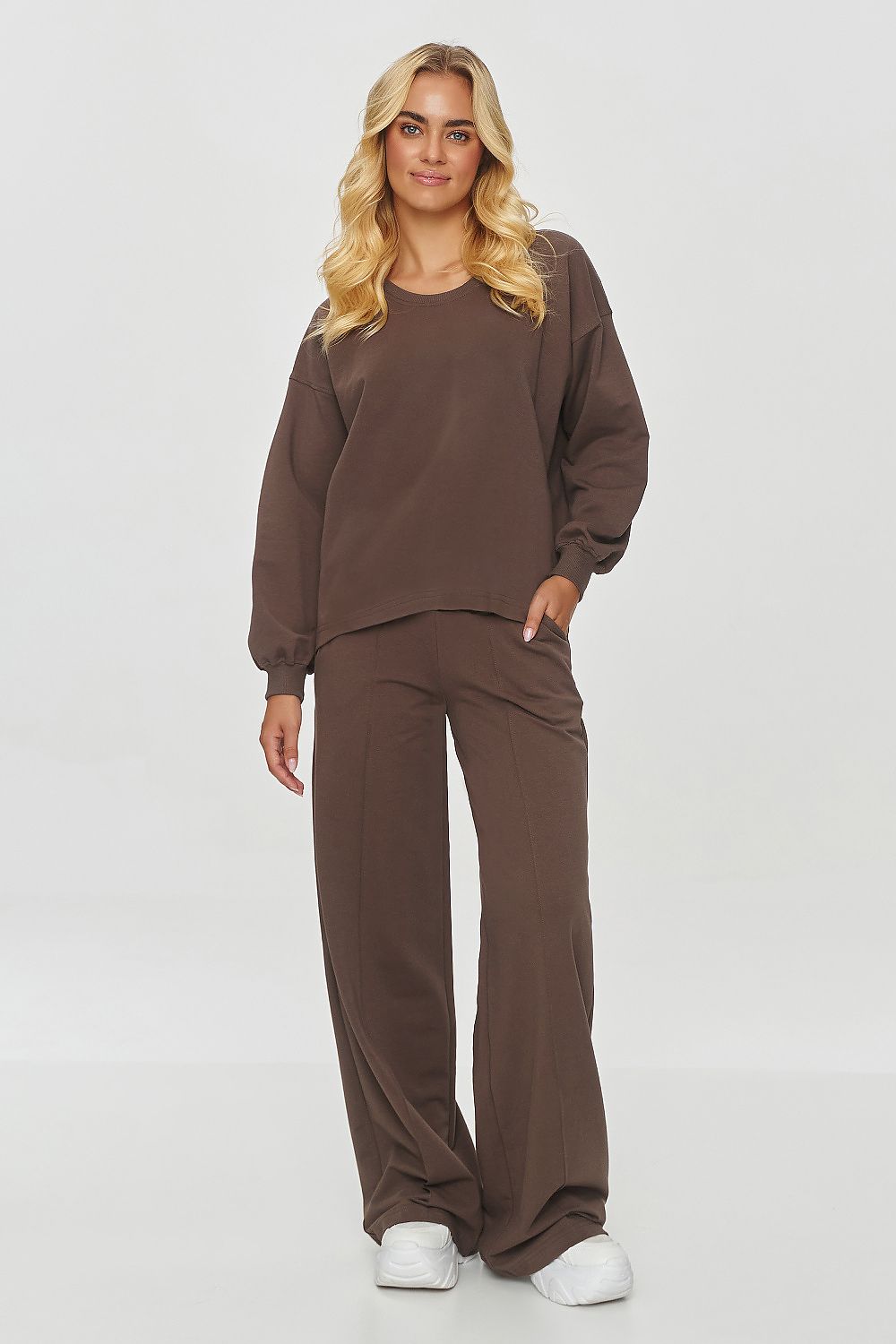 Luxury Makadamia tracksuit set featuring an oversized sweatshirt and wide leg trousers, crafted from soft cotton blend for ultimate comfort.