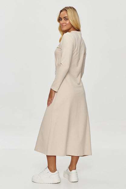 Elegant draped midi dress by Makadamia showcasing a subtle gathered waist detail and high neckline, perfect for chic occasions.