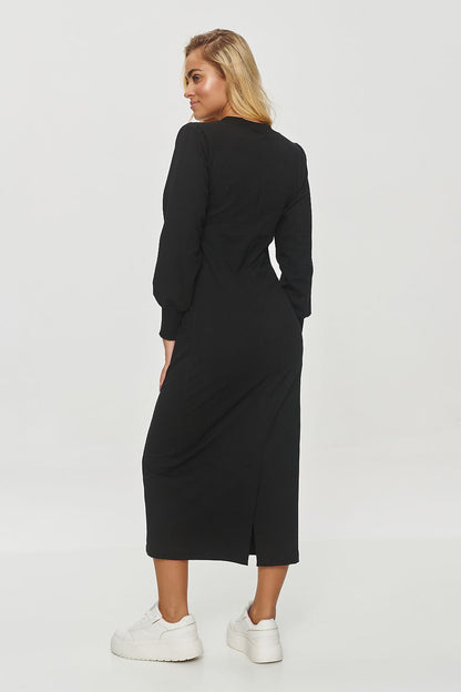 Elegant Makadamia midi daydress showcasing a sophisticated V-neckline and long sleeves, perfect for chic outings.
