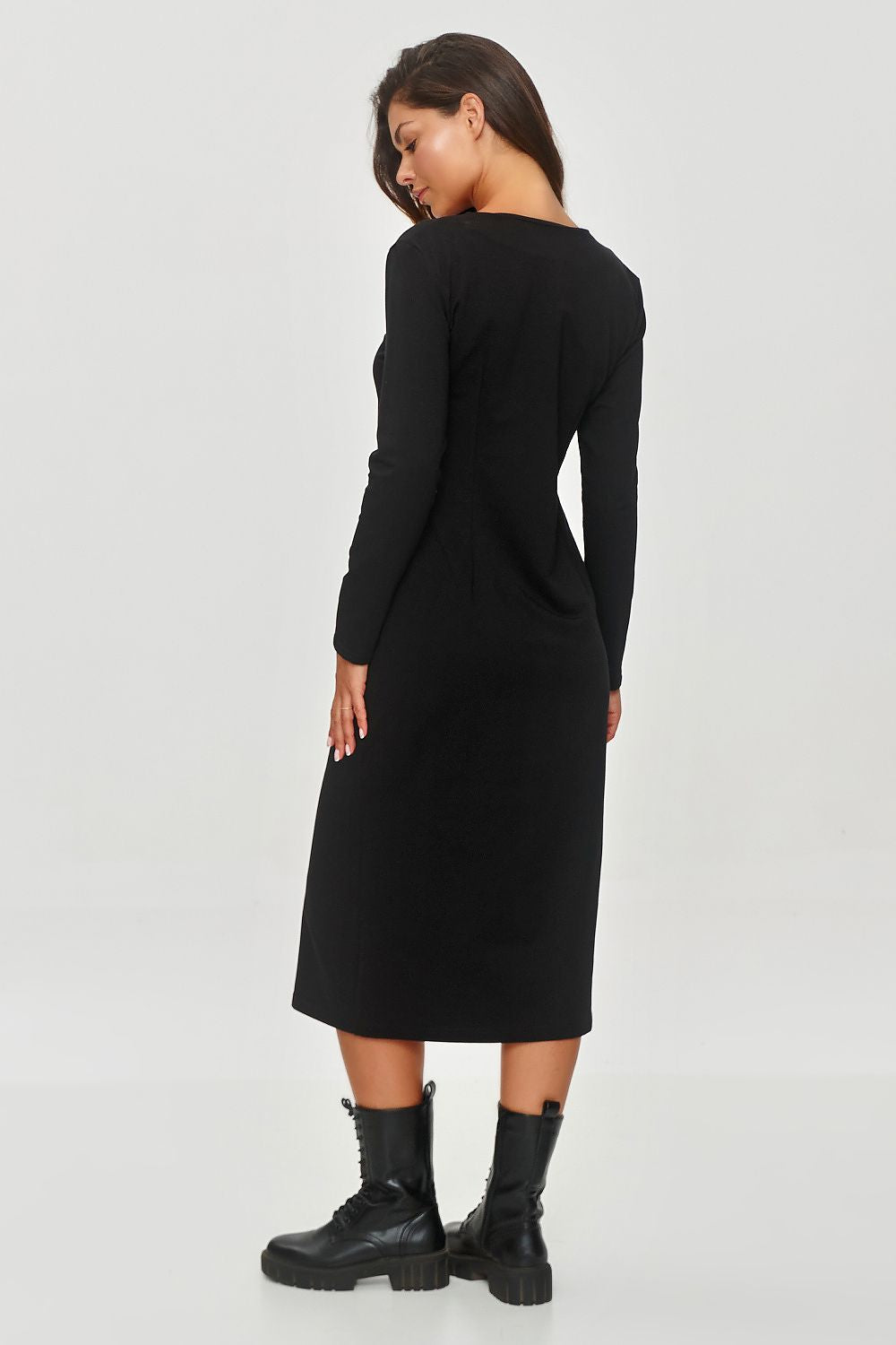 The elegant silhouette of the Makadamia V-Neck Sweatshirt Dress, featuring a stunning soft fabric, perfect for a luxuriously comfortable look.