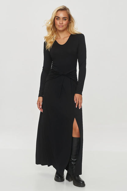 Full view of the Makadamia elegant long dress, highlighting the fitted bodice and graceful fabric flow, ideal for sophisticated occasions.