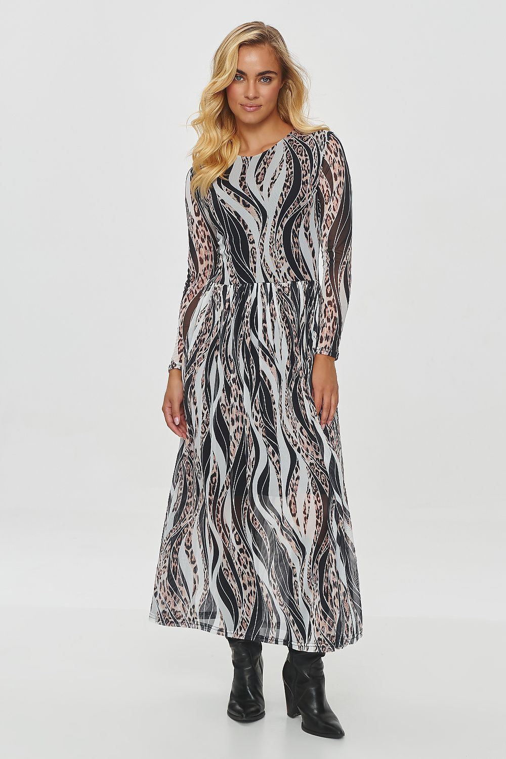 Elegant long printed daydress by Makadamia showcasing flowing, semi-transparent fabric with intricate motifs in warm autumnal colours.