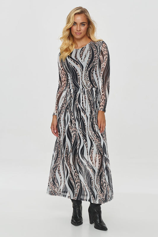 Elegant long printed daydress by Makadamia showcasing flowing, semi-transparent fabric with intricate motifs in warm autumnal colours.