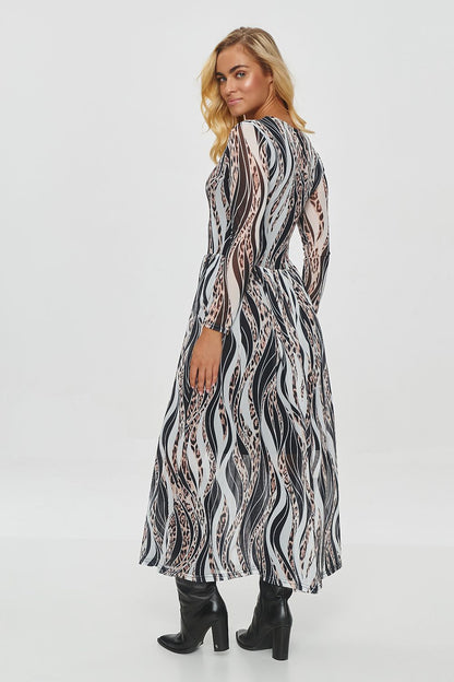 Beautifully fitted top of the long printed dress by Makadamia, accentuating the waist with unique plant and animal print patterns.