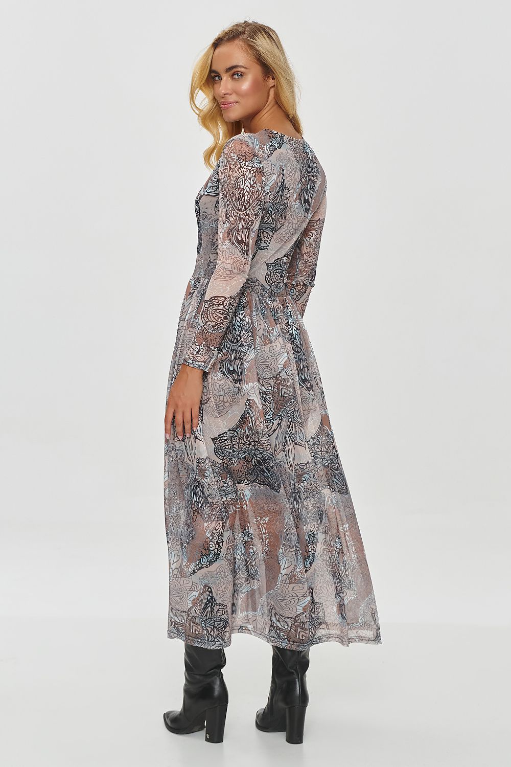 Elegant long printed daydress by Makadamia featuring a flowy material with intricate plant and animal motifs in warm autumn colours, perfectly styled for romantic winter evenings.