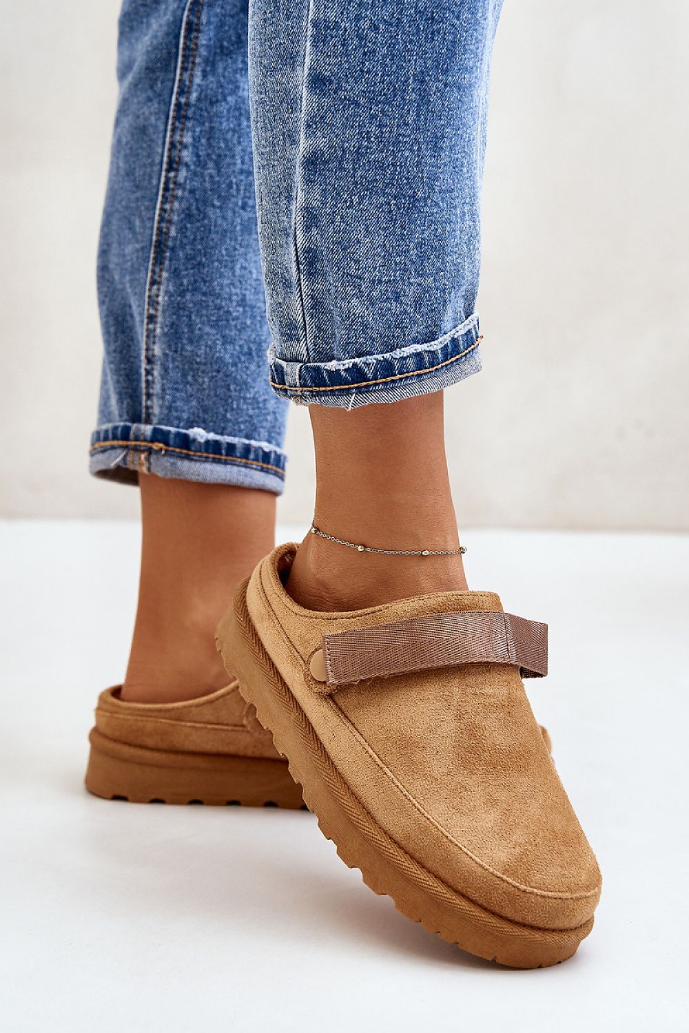 Step in Style women's eco suede slippers with luxurious fur lining, offering fashionable support and comfort for daily wear.