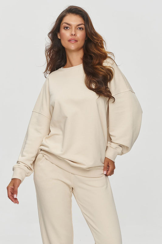 Luxury Makadamia loose-fit sweatshirt in soft cotton blend featuring adjustable ribbed neckline and relaxed fit, perfect for urban style.