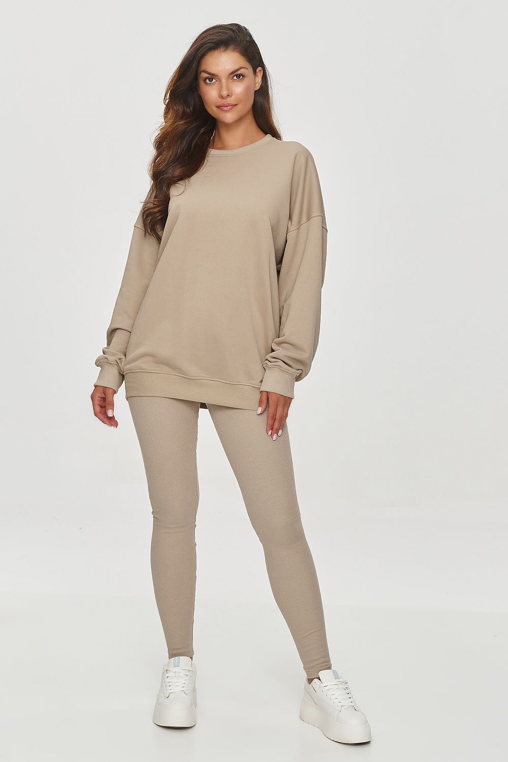 Luxurious loose-fit sweatshirt by Makadamia, showcasing a soft cotton blend material and adjustable ribbed neckline, perfect for a chic, casual look.
