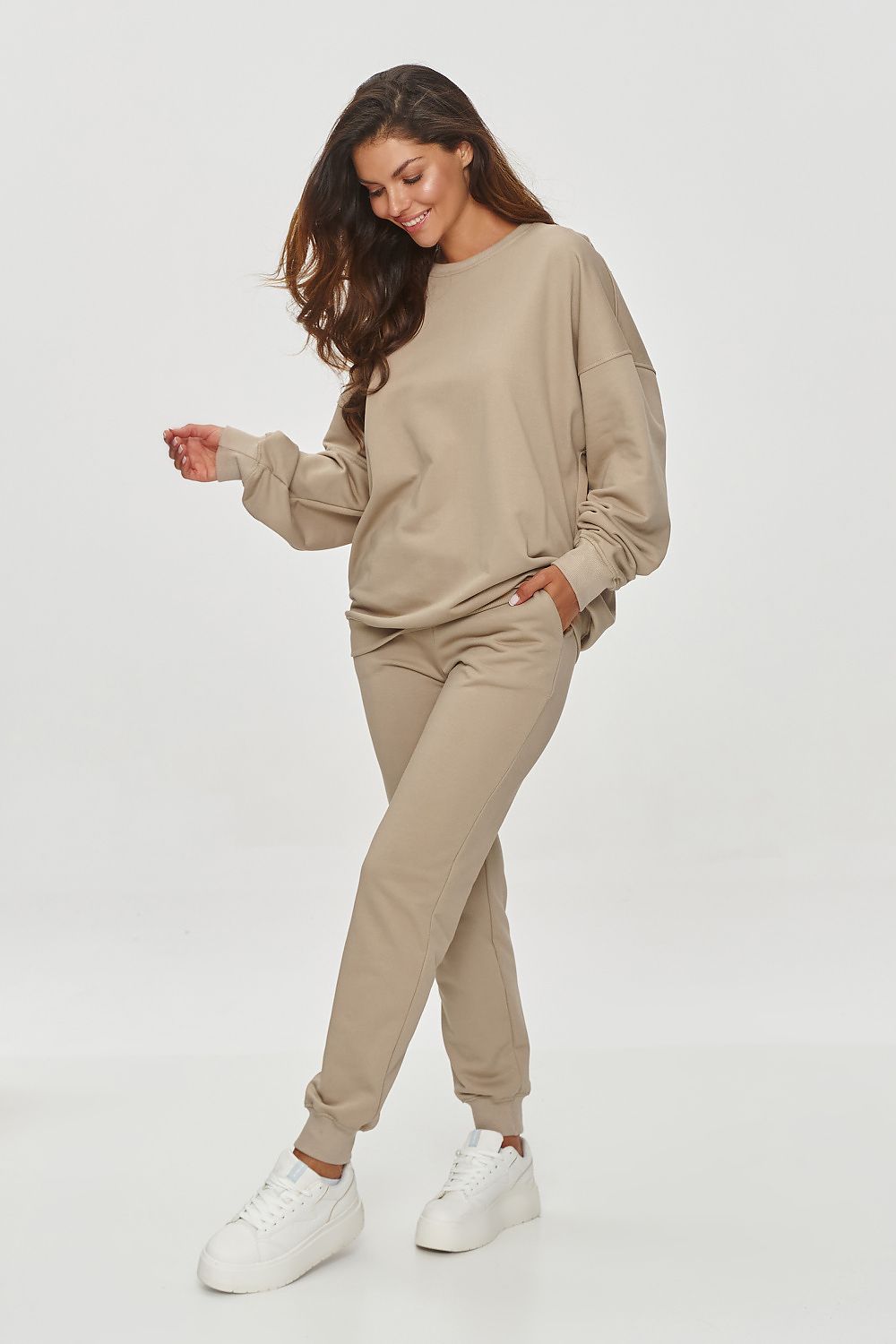 Elegant Makadamia Classic Tapered Sweatshirt Trousers showcasing an elastic waistband for ultimate comfort and practicality.