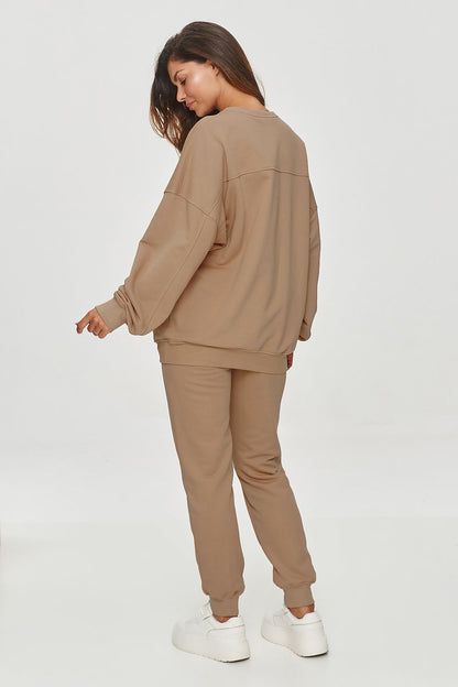 Makadamia Classic Tapered Sweatshirt Trousers on display, illustrating a relaxed yet sophisticated silhouette suitable for casual occasions.