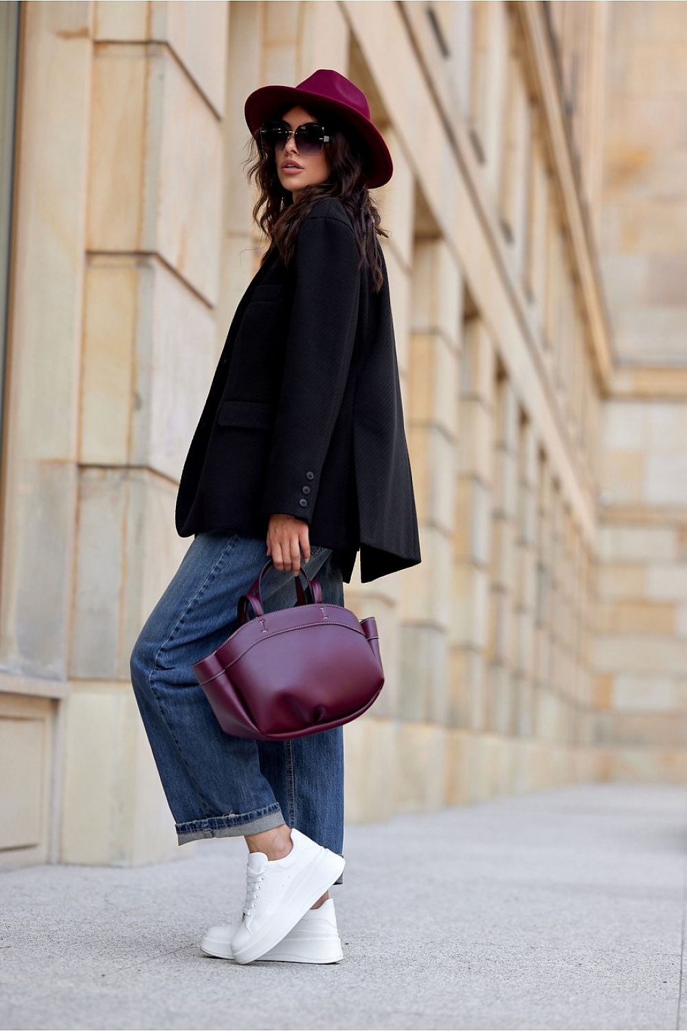 Elegant loose cut blazer by Roco Fashion showcasing decorative collar and fancy button details on a stylish model.