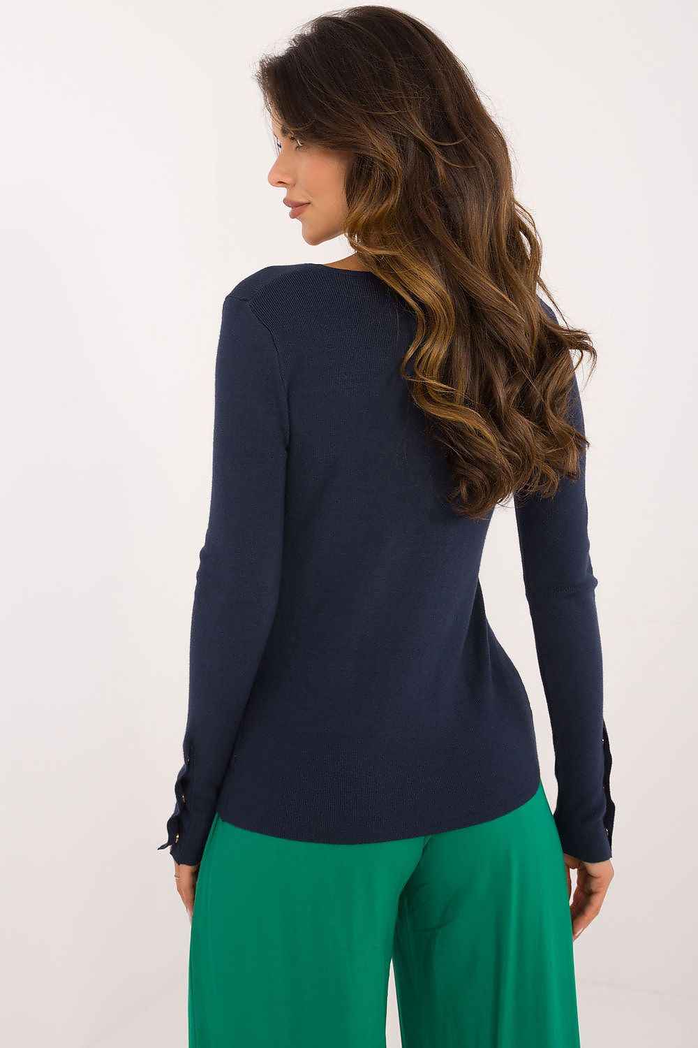 Close-up of AT women's sweater in soft material, showcasing the decorative buttons at the wrists and delicate V-neck design.