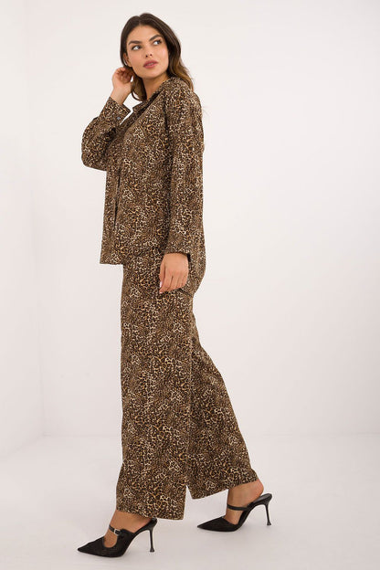 Luxurious women's set by Italy Moda featuring elegant animal motif shirt with long sleeves and wide-leg pants, made from a premium polyester-elastane blend for ultimate comfort and style.