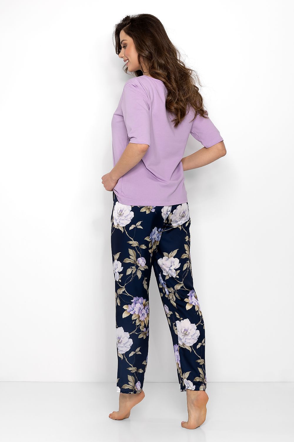 Stylish women's pyjama set from Momenti Per Me, complete with a U-shaped neckline blouse and comfortable elastic waistband pants, perfect for home lounging.