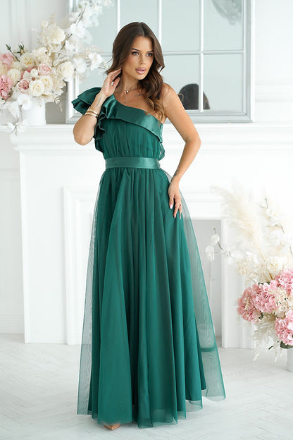 Elegant long dress designed by Bicotone featuring a high slit and satin ruffle, embodying feminine luxury and comfort, perfect for special occasions.