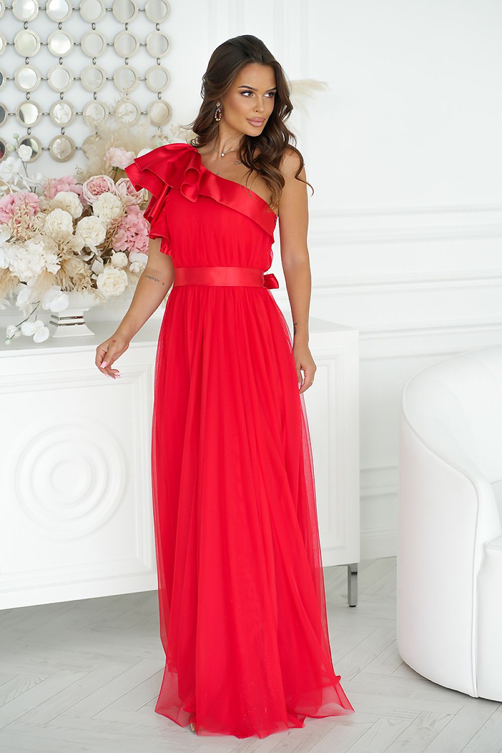 Elegant long dress by Bicotone with high slit and satin ruffle, designed for femininity and comfort in luxurious style.