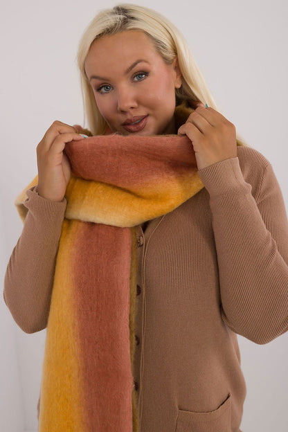 AT's luxurious 194 cm polyester shawl with tassels, offering a modern touch for seasonal fashion.