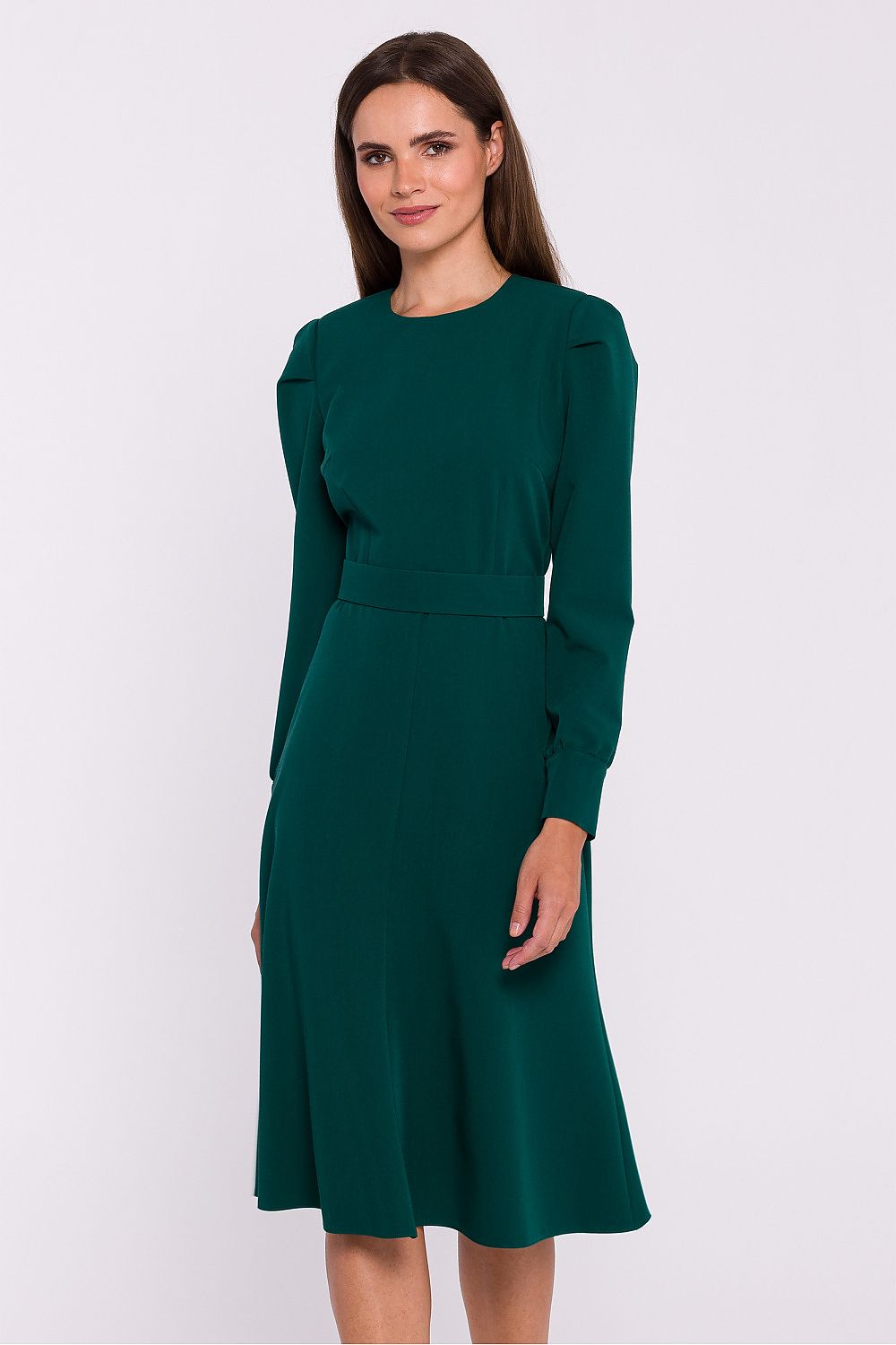 Stylove elegant flared day dress featuring long sleeves, a belted waist, and distinctive button cuffs, perfect for stylish occasions.