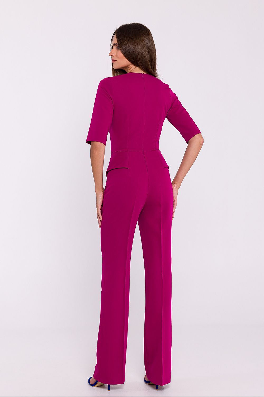 Back view of the elegant jumpsuit by Stylove, highlighting the covered zipper and feminine fit.
