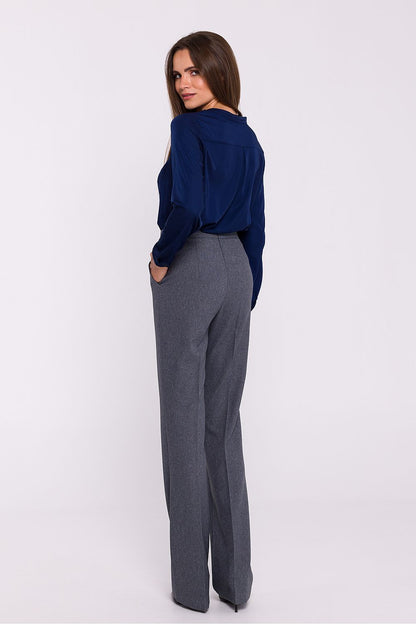 Stylish women's flared trousers by Stylove displayed on a model, highlighting the sophisticated high rise and elegant flared design.